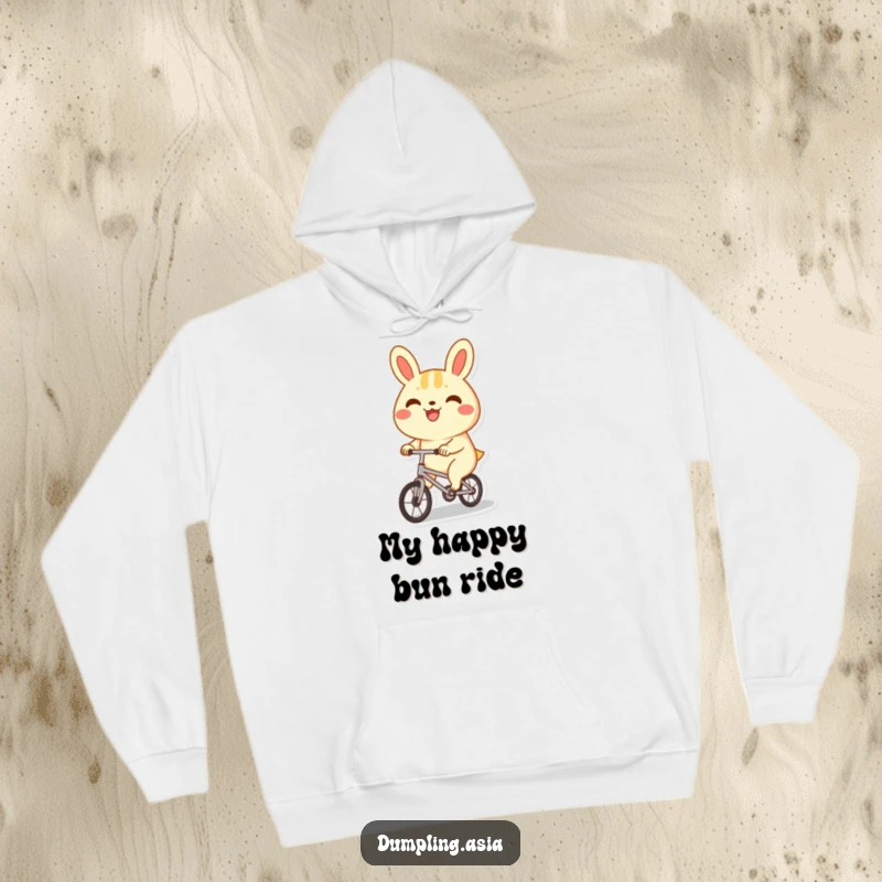Funny bao bun hoodie, a happy character with a big grin, joyfully riding a tiny bicycle, cozy and cute.